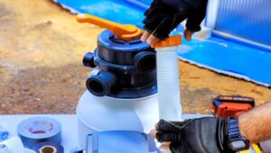 A person cleaning a pool filter